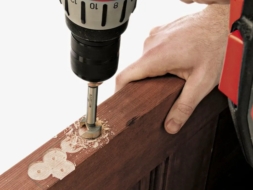 How to Cut Door Hinges With a Drill